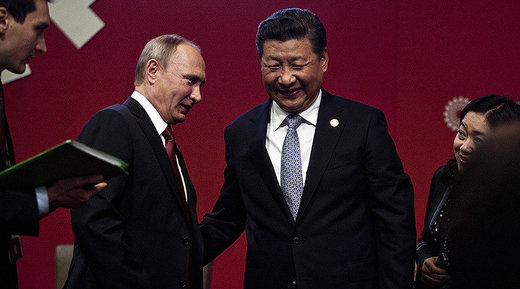 President Vladimir Putin (2nd L) chatting with China's President Xi Jinping (2nd R) at the start of the ABAC and APEC Leaders' Dialogue at the Asia-Pacific Economic Cooperation (APEC) Summit in Lima