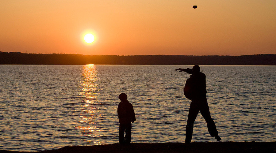 Father and son on beach