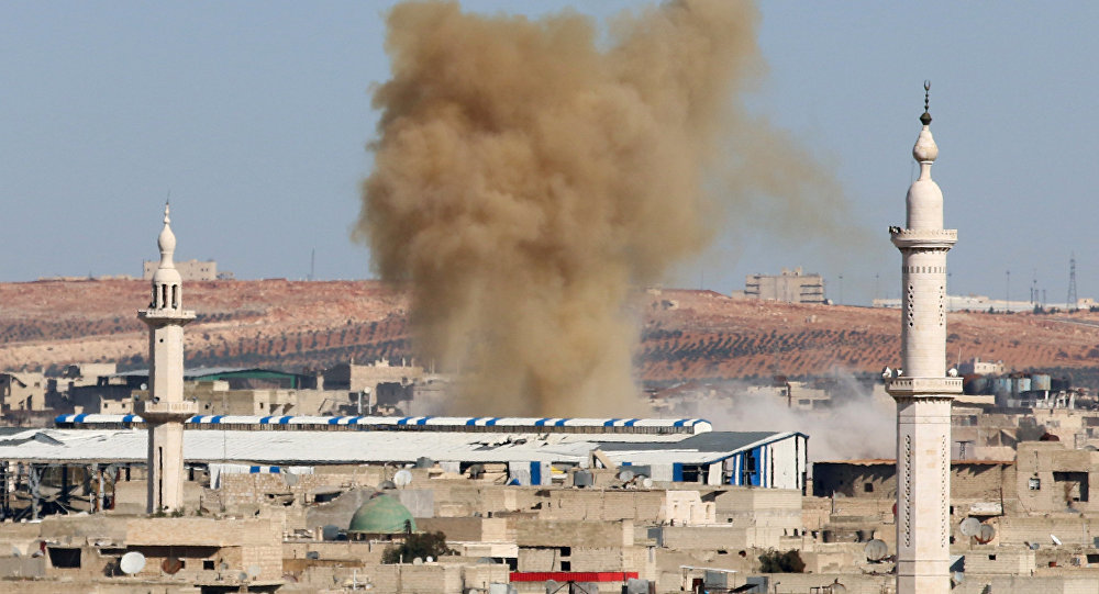Click to enlarge Smoke rises from a militant held neighborhood of Aleppo