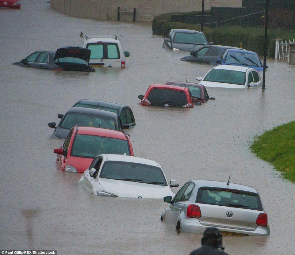 The flooded Whitchurch Lane in Bristol, pictured, was hit with more heavy rain during the course of the day