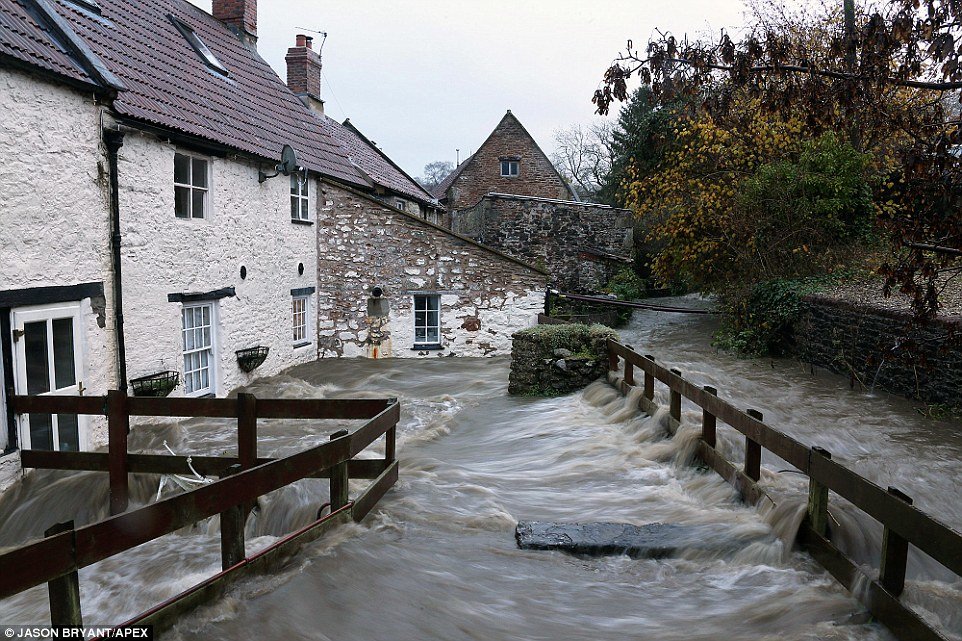 Click to enlarge A house is surrounded by flood waters at Croscombe in Somerset following torrential rain in the south west of England