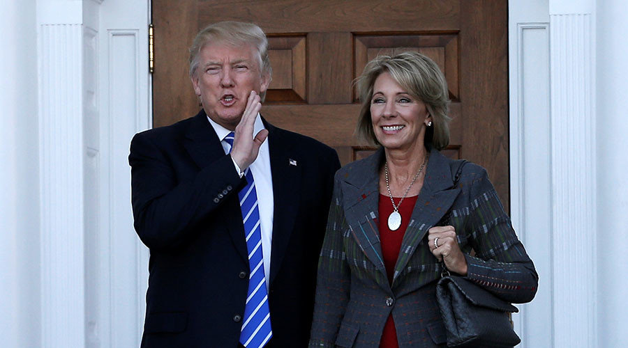 Click to enlarge Trump and Betsy DeVos