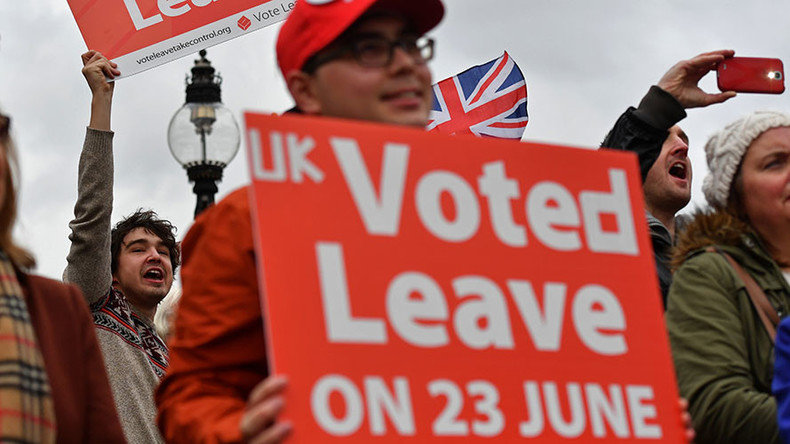 Protestors hold placards during an anti-European Union (EU) demonstration