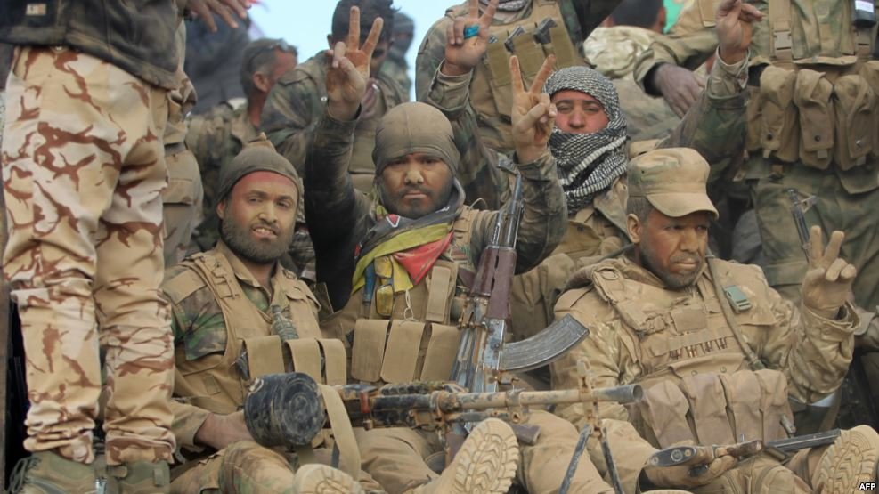 Click to enlarge Shi'ite militia fighters