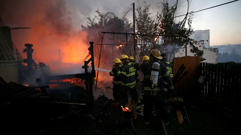 Click to enlarge Israeli firefighters