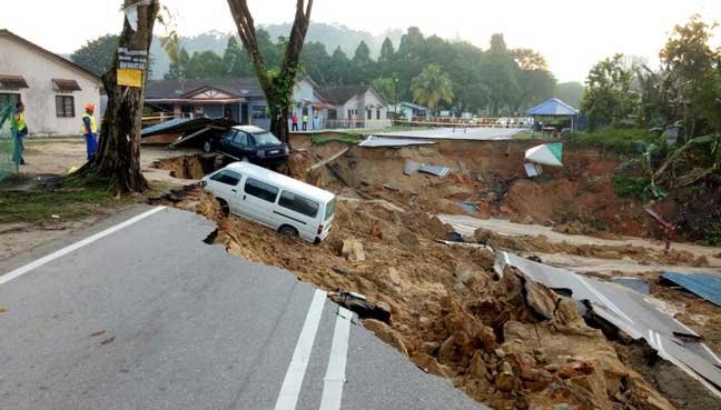 At least six cars, two motorcycles and one van were swallowed up by earth in the 1.20am incident.
