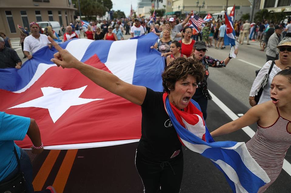 Residents take to the streets outside the restaurant Versailles in Miami on Saturday as they react to the news of the death of former Cuban President Fidel Castro. 