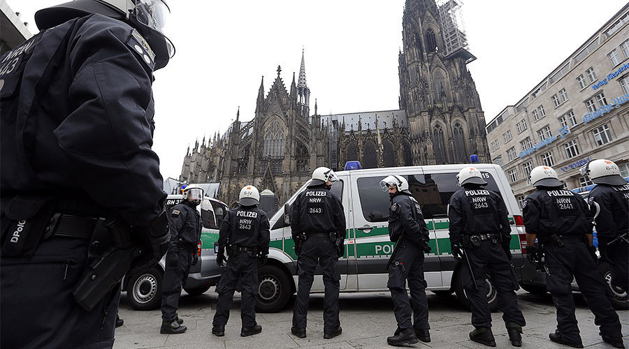 German riot police stand in front of the Cologne Cathedral