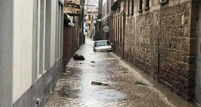 Click to enlarge A flooded street in Ayvalık, Balıkesir.