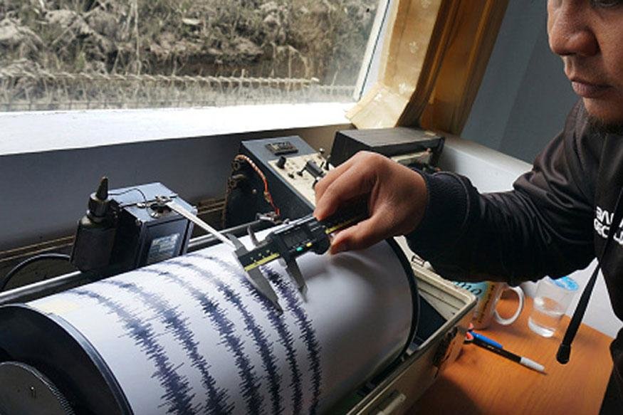 A man mapping the intensity of earthquake.
