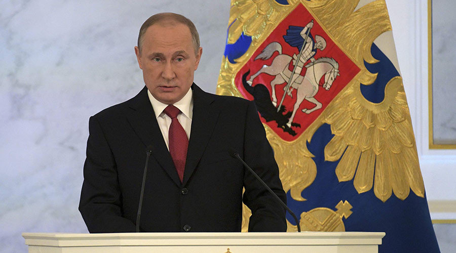 Click to enlarge Russian President Vladimir Putin delivers a speech