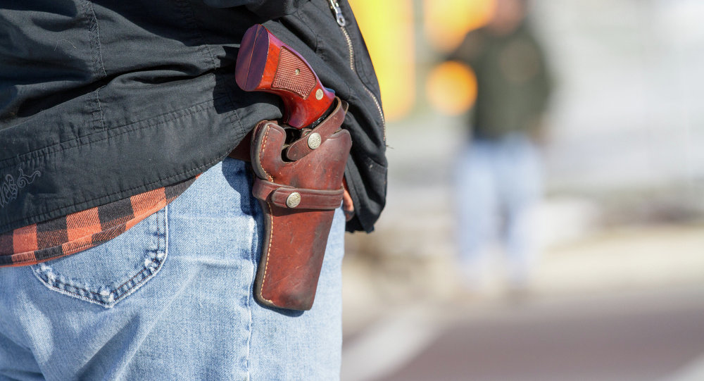 Man carrying handgun