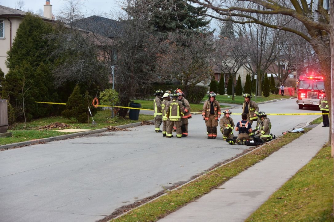 Click to enlarge A man raking leaves at his North York home suffered minor injuries after a 2-meter sinkhole opened beneath him, and swallowed him up to the neck.