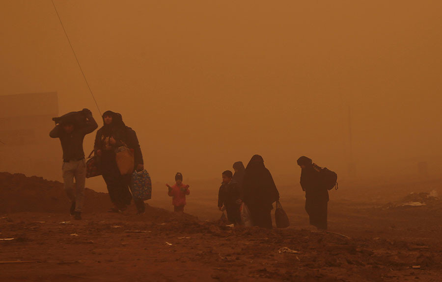 Click to enlarge Iraqi people flee the Islamic State stronghold of Mosul