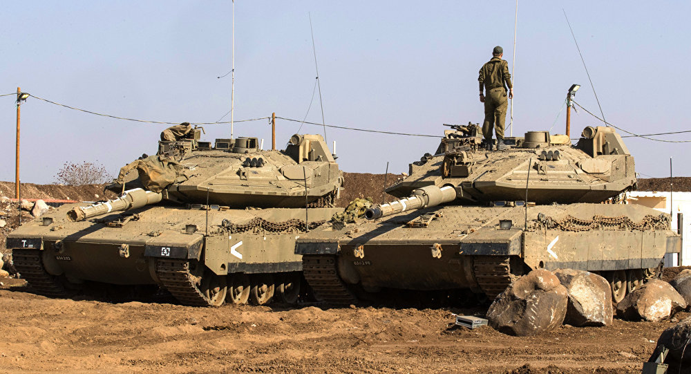 Israeli soldier standing on tank