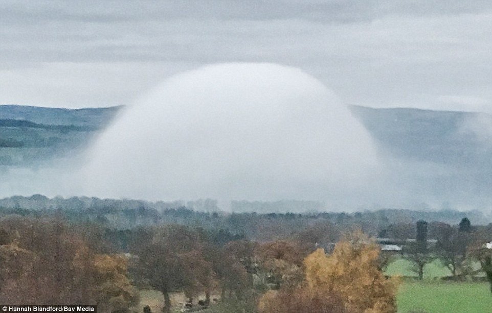 Click to enlarge A rare UFO-like 'fog dome' (pictured here) was spotted by a dog walker in North Wales yesterday morning at 8am