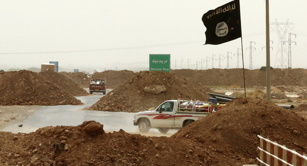 Click to enlarge Islamic State militants passing a checkpoint bearing the group's trademark black flag in the village of Maryam Begg in Kirkuk, 290 kilometers (180 miles) north of Baghdad,Iraq