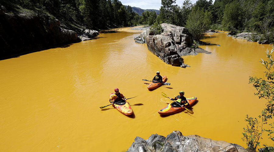 Aug. 6, 2015 - Durango, Colorado, U.S. - People kayak in the Animas River near Durango, Colo., in water colored from a mine waste spill. 