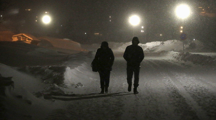 Refugees walk to camp winter Sweden