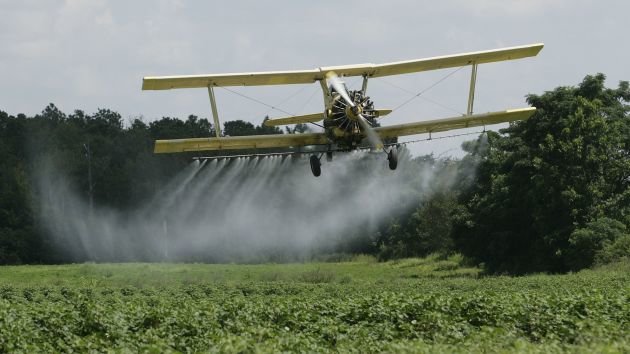 Click to enlarge pesticide spraying