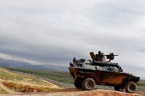 Click to enlarge Turkish soldier on armoured military vehicle