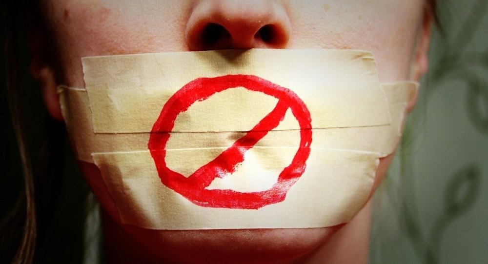 Click to enlarge face with mouth taped shut