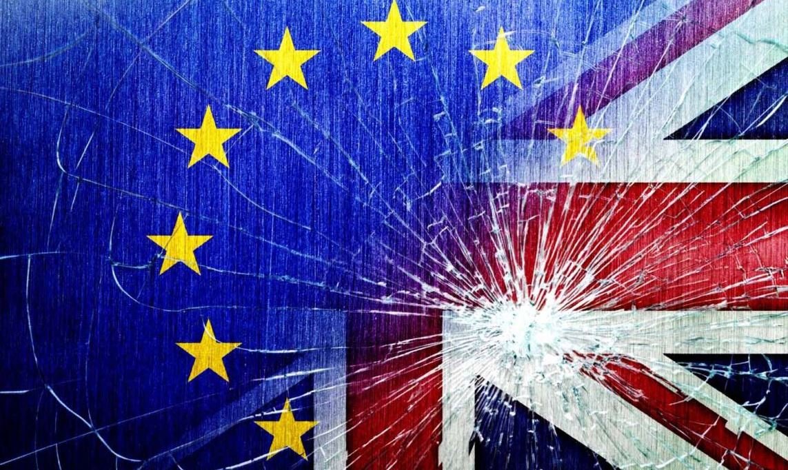 EU and UK flags with broken glass