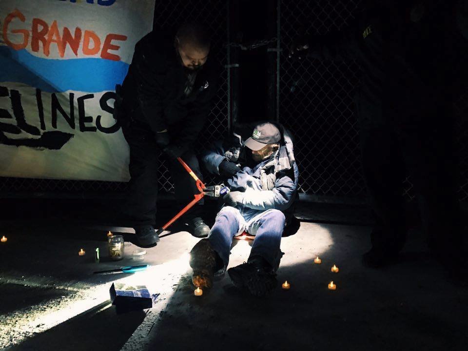 Click to enlarge Roger Siglin being arrested for protesting pipeline