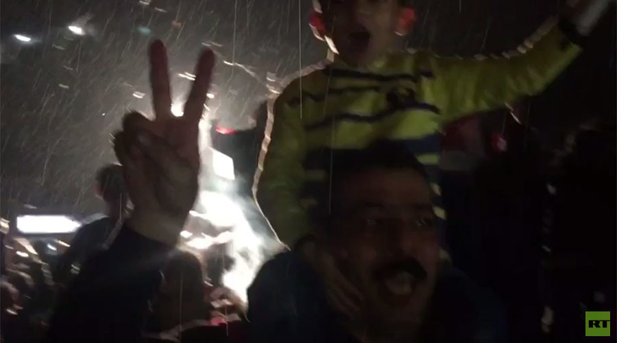 Click to enlarge Aleppo residents cheer victory