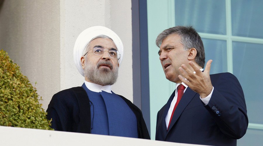 Former Turkish President Abdullah Gul (R) and Iranian President Hassan Rouhani