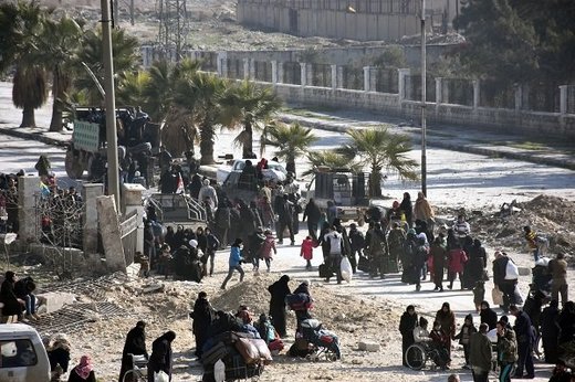 Syrian civilians arrive at a checkpoint