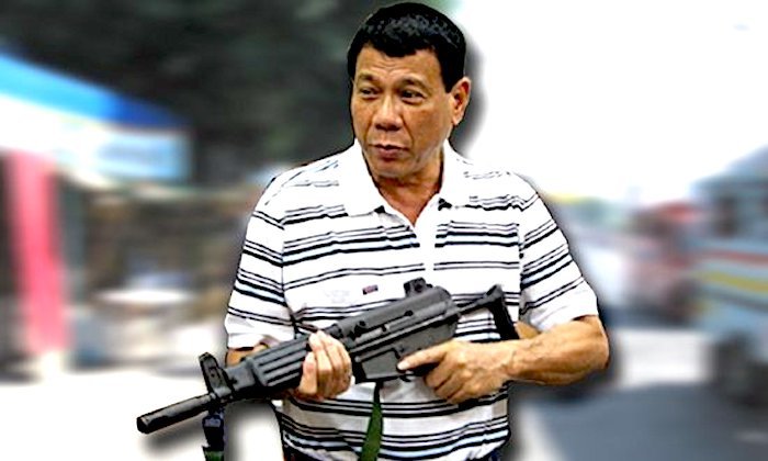 Click to enlarge Duterte and gun