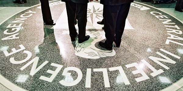 Men standing on CIA logo