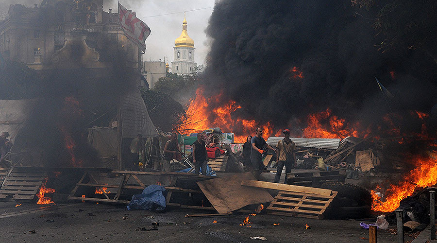 Burning car tires set on fire on Independence Square (Maidan) in Kiev