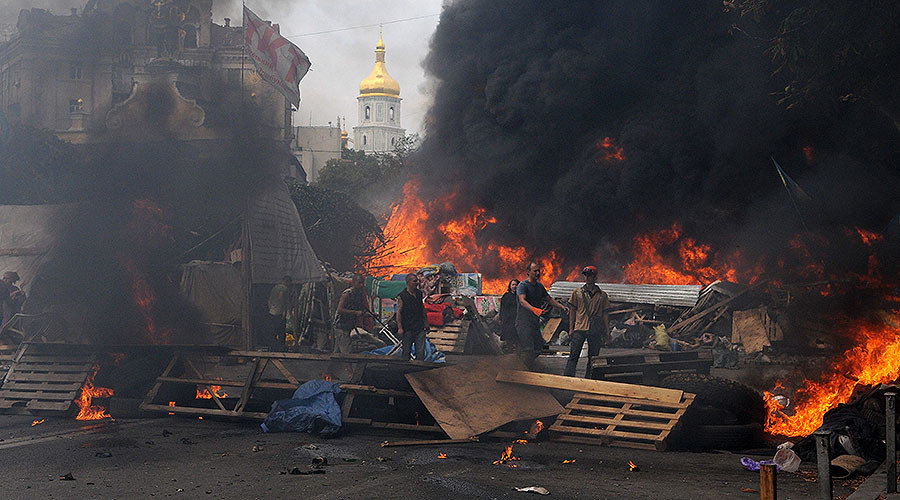 Click to enlarge Burning car tires set on fire on Independence Square (Maidan) in Kiev