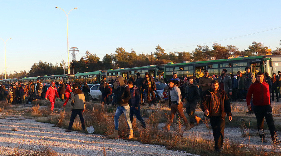Click to enlarge Evacuees from rebel-held east Aleppo, disembark from buses upon their arrival to the town of al-Rashideen, which is held by insurgents, Syria December 15, 2016