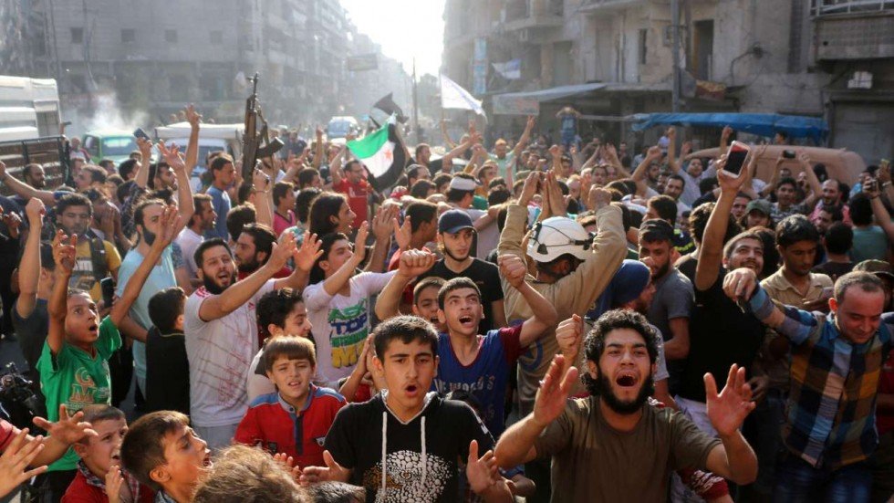 Click to enlarge Syrian gather in a street in the northern city of Aleppo in celebrations after rebels said they have broken a three-week government siege on Syria's second city.