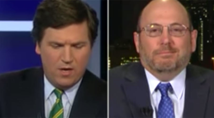 Fox News host Tucker Carlson (L) interviews Newsweek writer Kurt Eichenwald (R)
