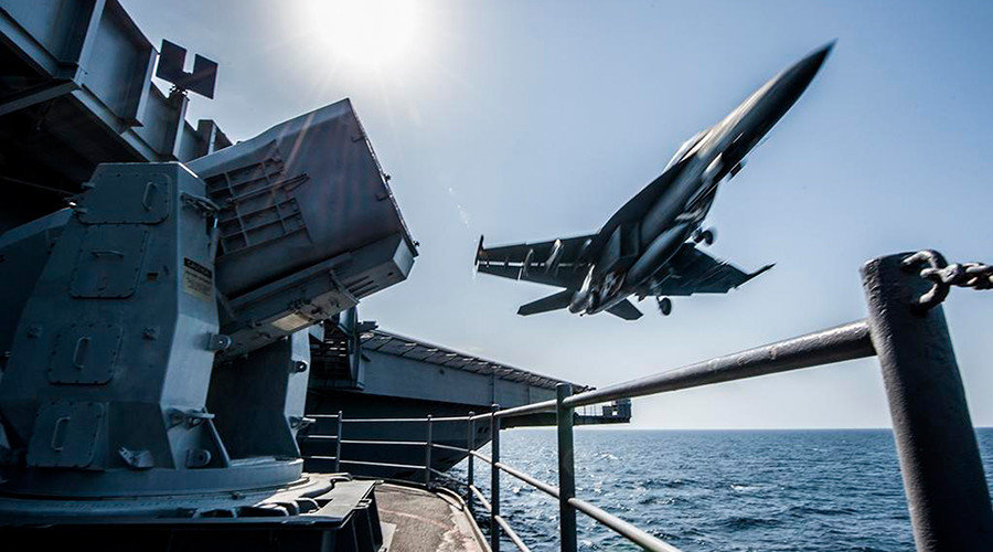 US jet taking off of air craft carrier