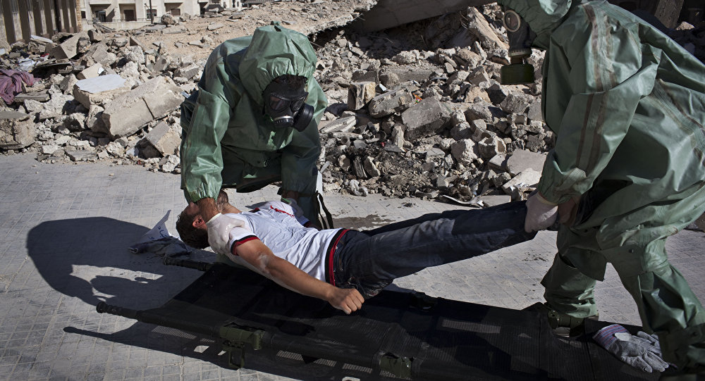 Volunteers take part in a simulation of how to respond to a chemical attack, in the northern Syrian city of Aleppo