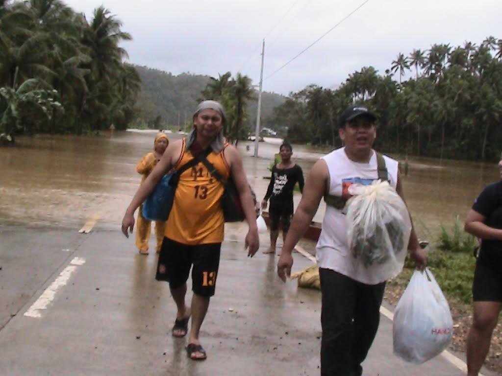  People force themselves to walk on the highway in Eastern Samar after floods rendered the roads impassable. 