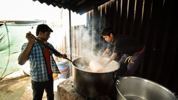 Man stirring pot