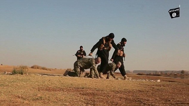 Click to enlarge ISIS dragging two Turkish soldiers