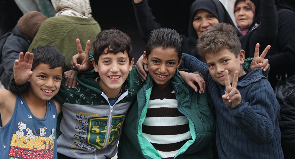 Click to enlarge Children celebrating Aleppo liberation