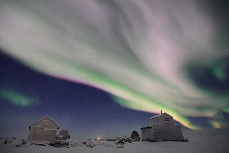 Click to enlarge Pink aurora over Alaska
