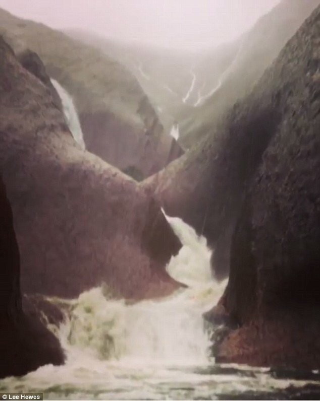 Photos and video from the base of Uluru showed huge pools forming below the waterfalls that lapped around raised walkways