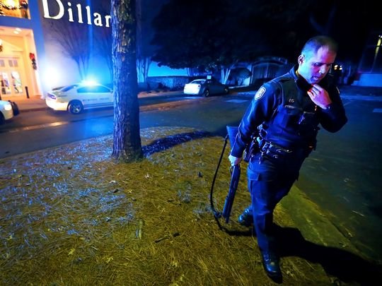 Memphis police officers block off the entrances to the Oak Court Mall Monday night after a disturbance in the food court sent patrons into a panic.