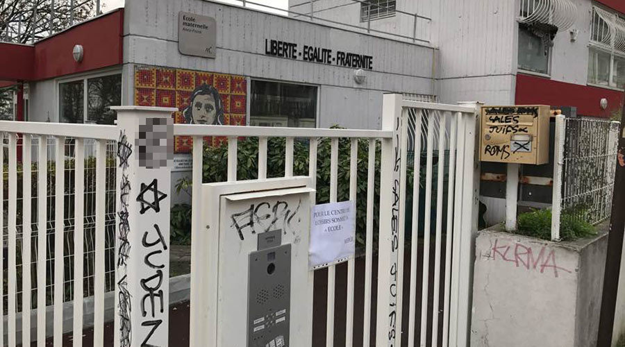 Click to enlarge Racist graffiti and swastikas found on Anne Frank school in France