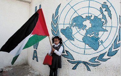 Child holding Palestine flag