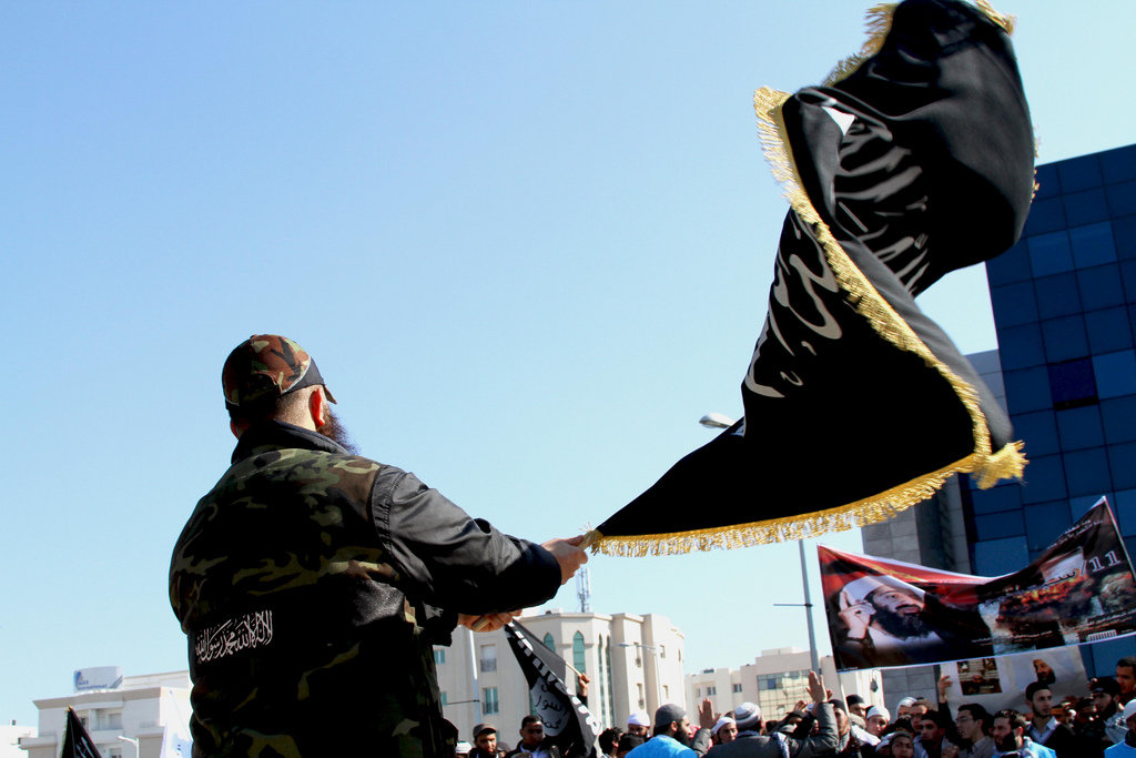 Terrorist holding flag